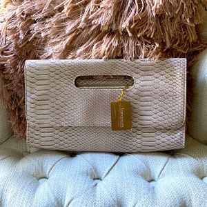 Mauve colored clutch purse. Brand new.